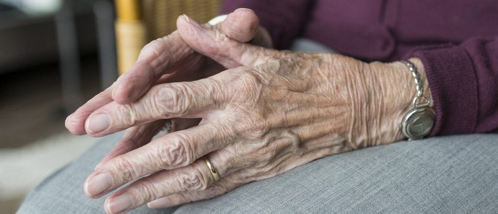 Photo of elderly person's hands together in their lap